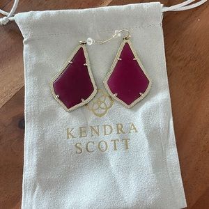 Kendra Scott gold Alex earrings with maroon stone